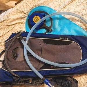 CamelBak style hydration backpack. Gray and blue, all pieces are brand new.